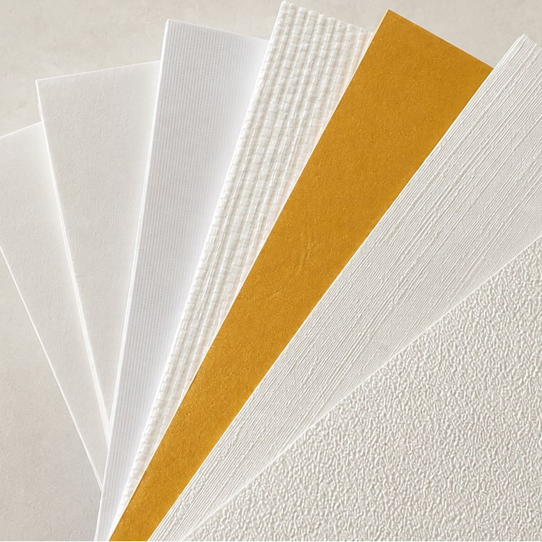 Set of white and gold greeting cards on a light beige background