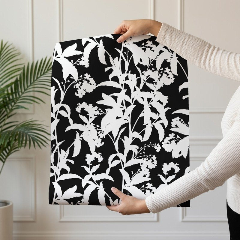 Black and White Flowers bold monochrome floral wallpaper shown on a single wallpaper drop