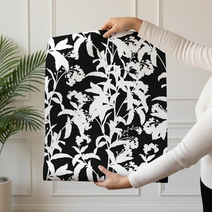 Black and White Flowers bold monochrome floral wallpaper shown on a single wallpaper drop