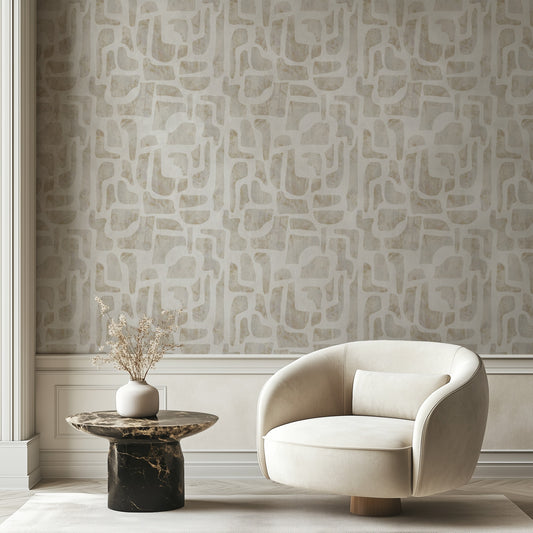 Bright Stones abstract stone-shape wallpaper in warm ivory and sand in a sunlit living room