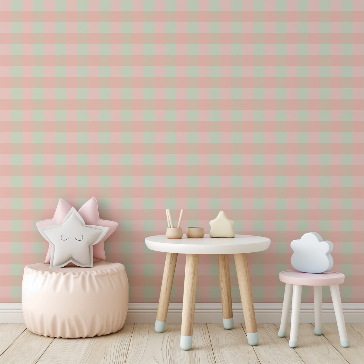 Blush, mint and sandy tan check wallpaper in a nursery with a star cushion, pouf and small white table