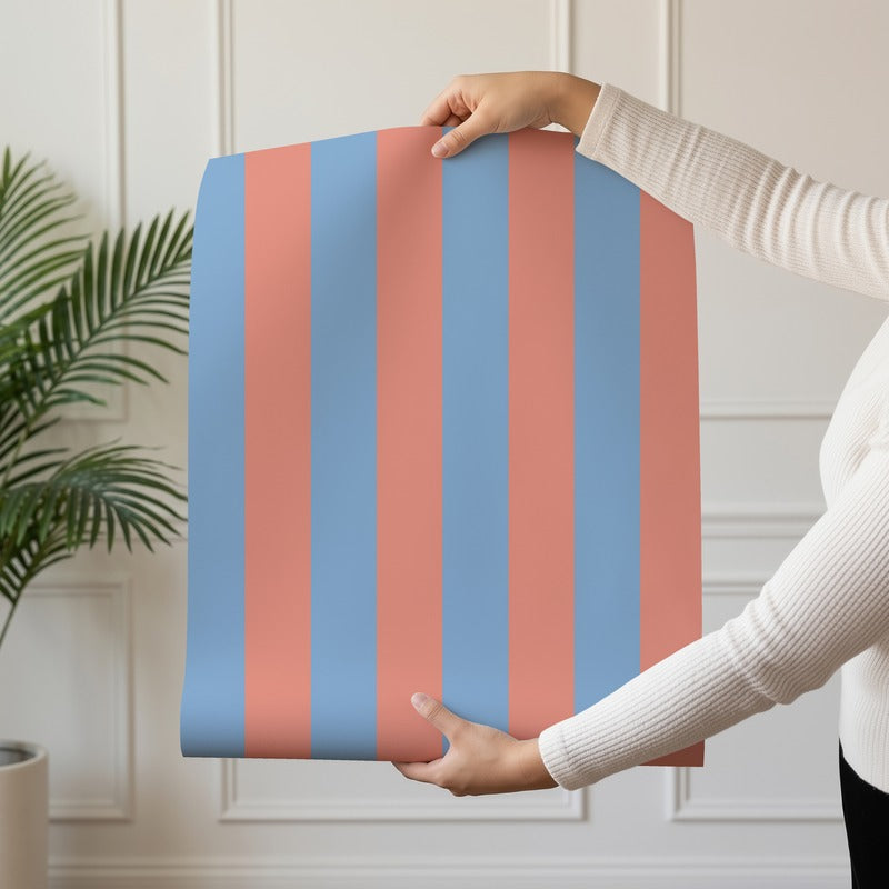 Classic Stripe Wallpaper roll in Cornflower Blue & Soft Coral – bold stripes on a soft coral ground