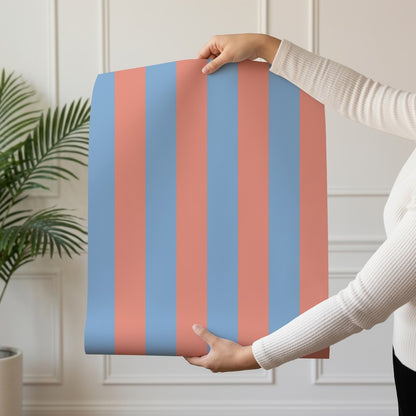 Classic Stripe Wallpaper roll in Cornflower Blue & Soft Coral – bold stripes on a soft coral ground