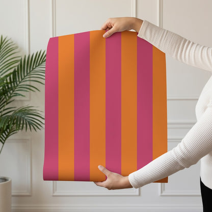 Classic Stripe Wallpaper roll in Pink & Tangerine – bold stripes on a tangerine ground