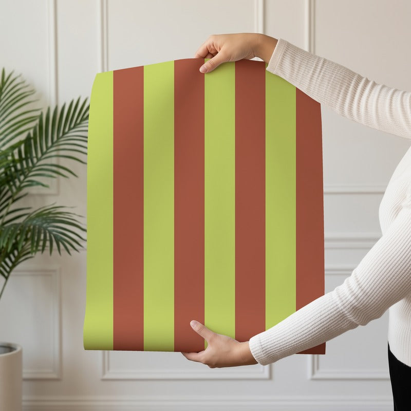 Classic Stripe Wallpaper roll in Soft Chartreuse & Burnished Rust – bold stripes on a burnished rust ground
