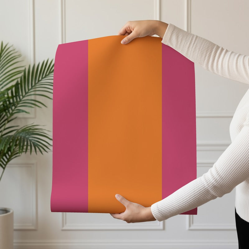 Extra-Wide Stripe Wallpaper roll in Pink & Tangerine – bright pink stripe on a tangerine ground