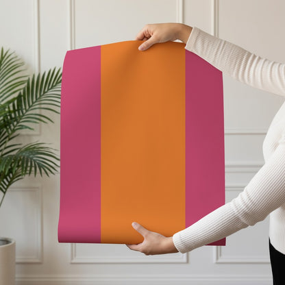 Extra-Wide Stripe Wallpaper roll in Pink & Tangerine – bright pink stripe on a tangerine ground
