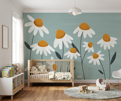 Daisy Vale mural behind a low wooden cot and bookshelf in a nursery