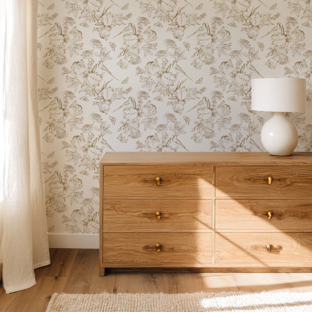 Golden Aviary antique-gold bird and floral wallpaper in an elegant bedroom