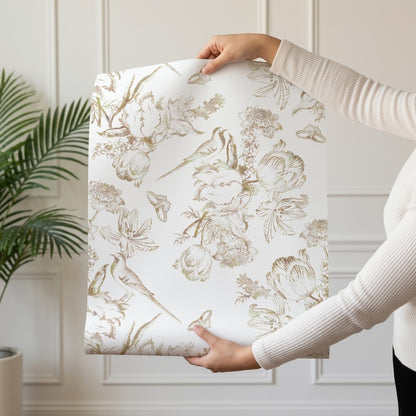 Golden Aviary wallpaper roll drop showing the engraved gold bird and peony repeat