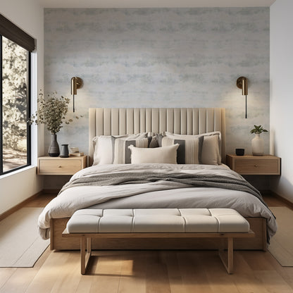 Gray Texture soft weathered concrete-effect wallpaper in pale cool grey in a calm neutral bedroom