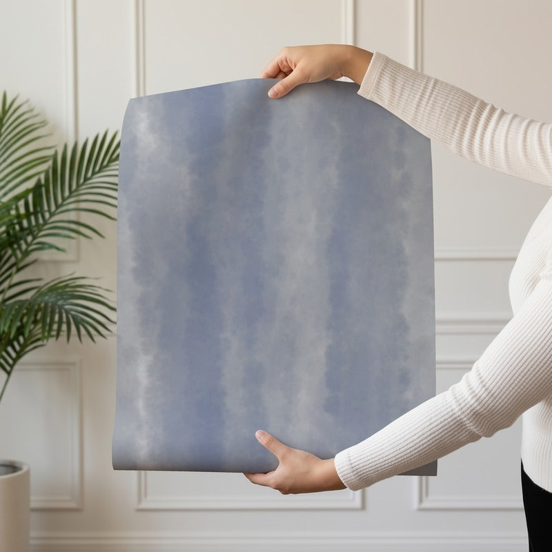 Indigo Tie-Dye wallpaper roll drop showing the dusty blue hand-dyed streak repeat