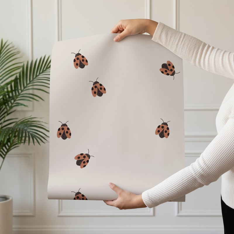 Ladybugs wallpaper roll drop showing the scattered ladybug repeat on oat
