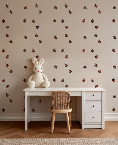 Ladybugs wallpaper behind a child's desk in a playful study corner