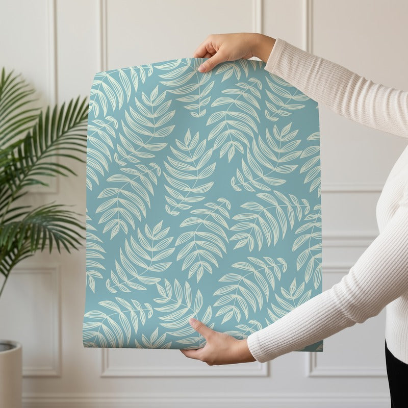 Laguna wallpaper roll drop showing the aqua palm frond repeat on lagoon blue