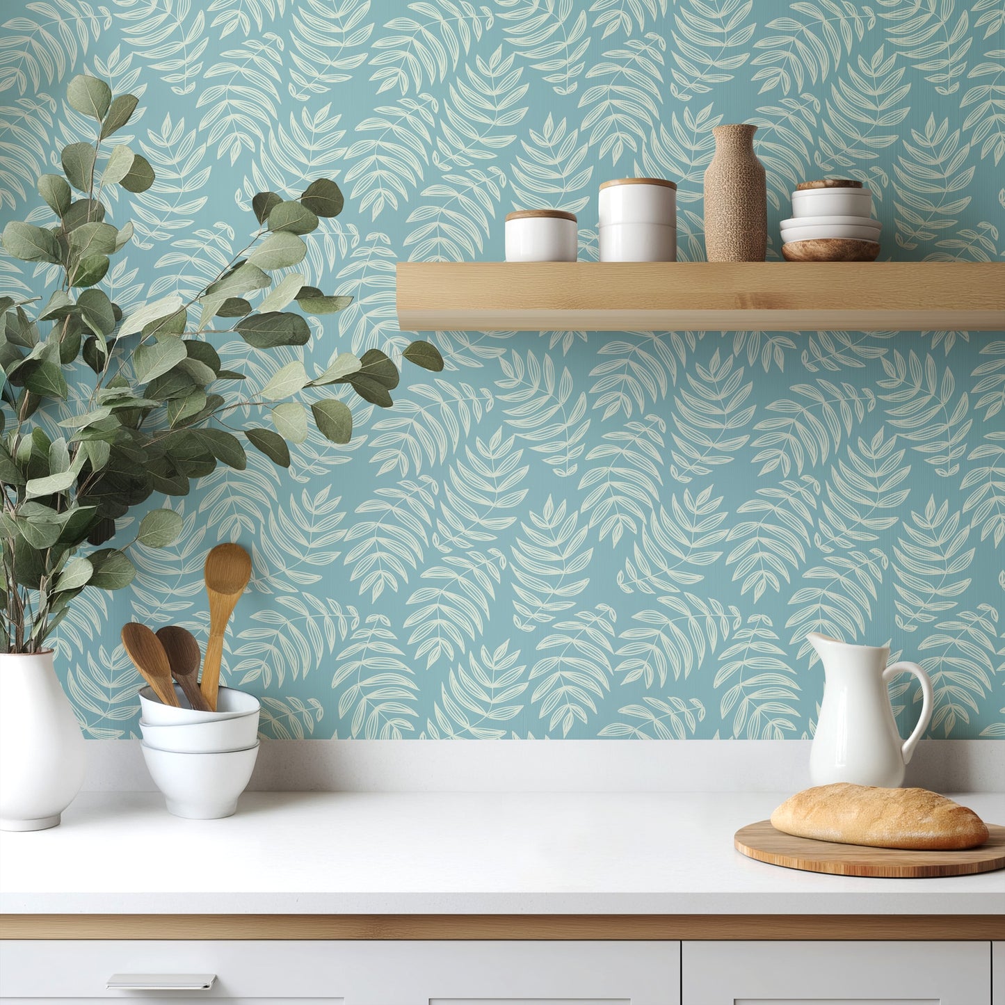 Laguna aqua and blue palm wallpaper in a fresh, light-filled kitchen