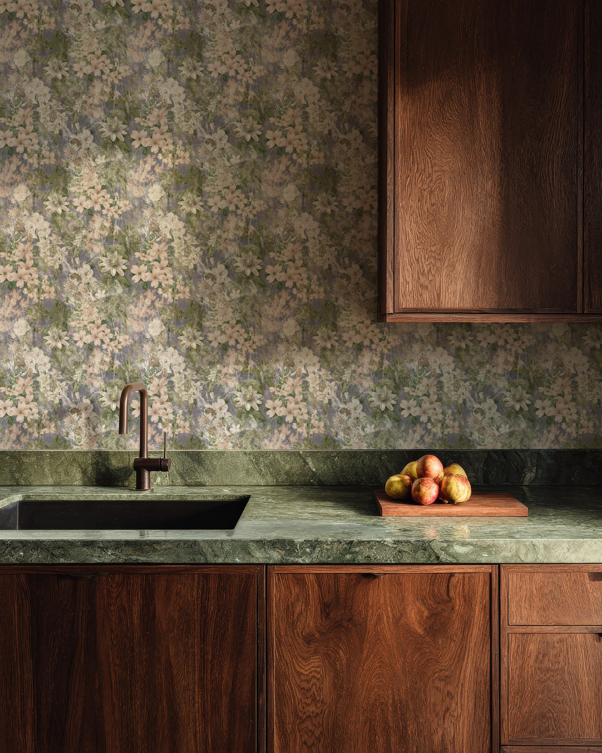 Lavender Dusk wallpaper in a kitchen with walnut cabinets and a green stone worktop