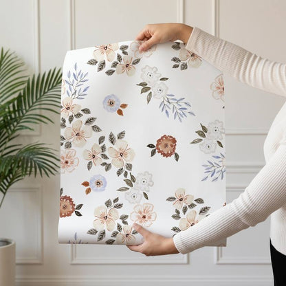 Meadow Posy wallpaper design — watercolour bouquets in cream, peach and rust with blue leaves on white