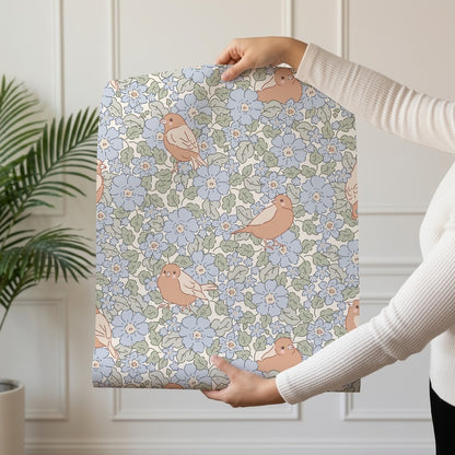Nido 02 wallpaper roll drop showing the songbird and blue floral repeat