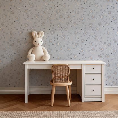 Starlit Meadow celestial floral wallpaper above a children's desk