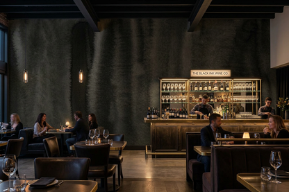 Nocturne Fold mural on the feature wall of a wine bar with a marble counter and candlelit tables