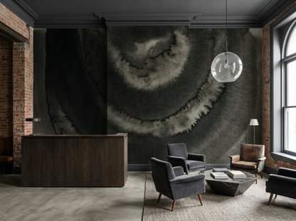 Nocturne Ripple mural on the feature wall of a boutique hotel lobby with a stone reception counter and tan leather lounge chairs