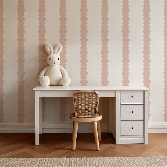 Scalloped Stripes Blush wallpaper behind a child's desk in a soft study corner