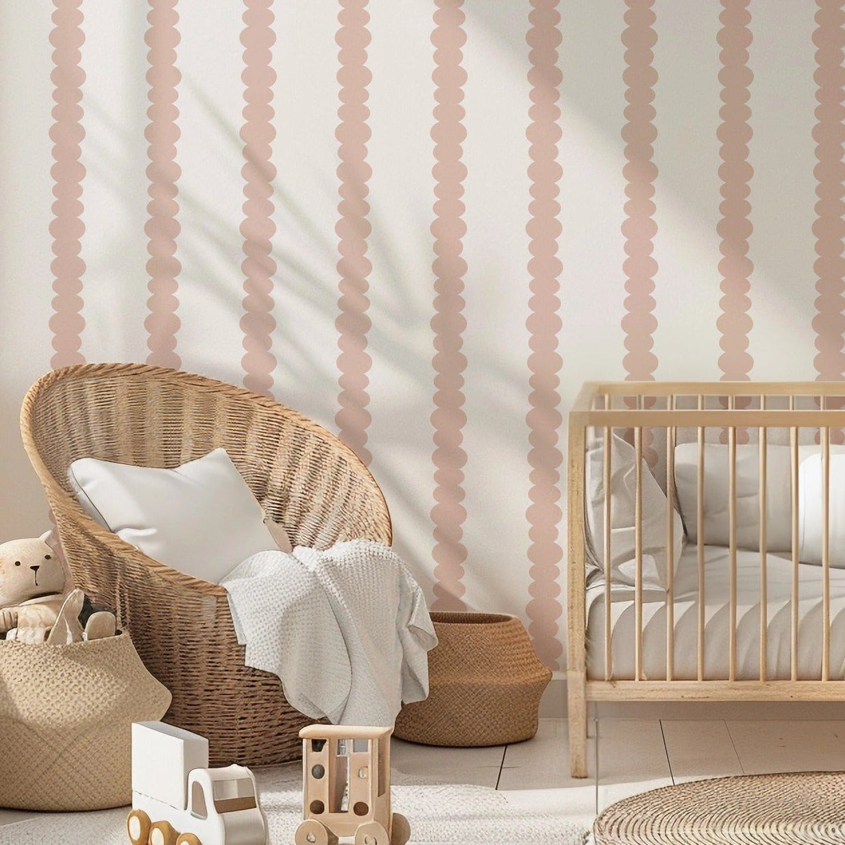Scalloped Stripes Blush wallpaper in a gentle, softly lit nursery