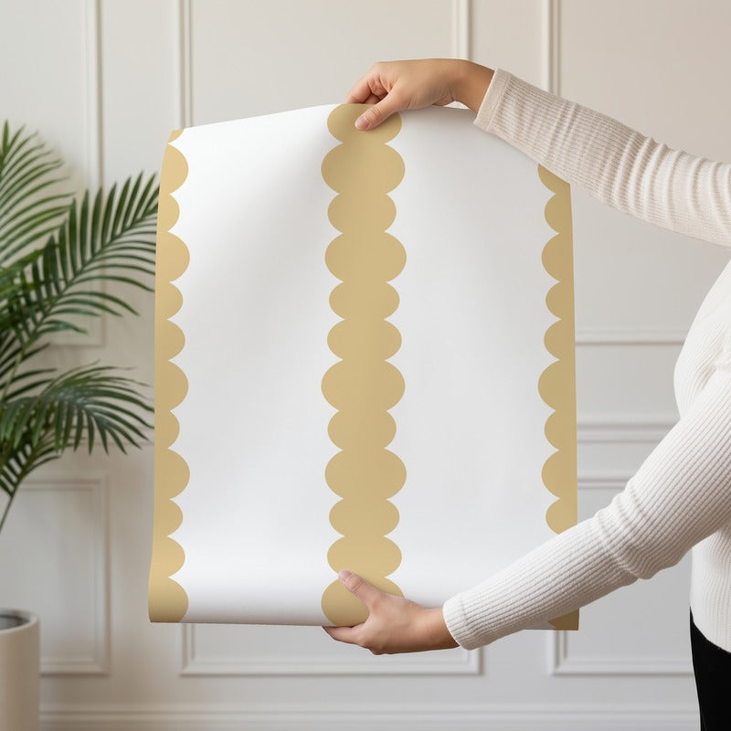 Scalloped Stripes Honey wallpaper roll drop showing the honey-gold scalloped pinstripe repeat