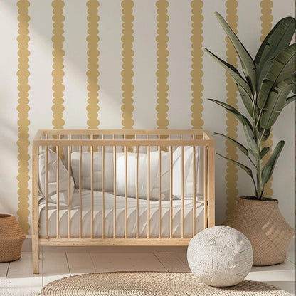 Scalloped Stripes Honey wallpaper in a gentle, softly lit nursery