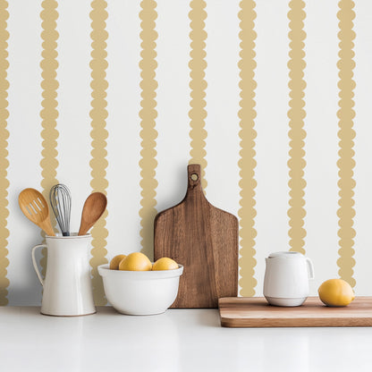 Scalloped Stripes Honey wallpaper in a bright kitchen with white cabinetry