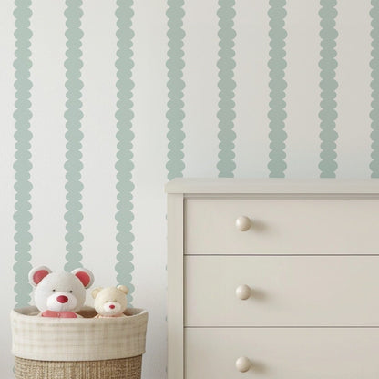Scalloped Stripes Mint wallpaper in a gentle, softly lit nursery