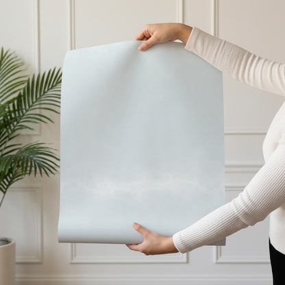 Sky Ombre wallpaper roll drop showing the soft blue-grey cloud gradient