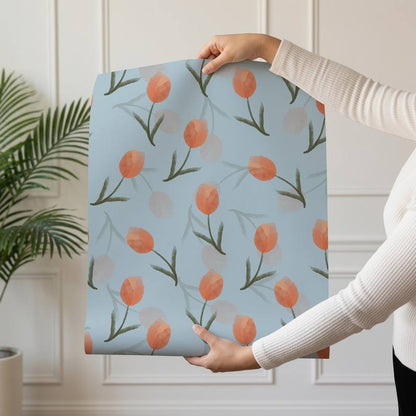 Tulip Bloom wallpaper design — soft coral watercolour tulips on dusty blue
