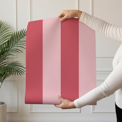 Wide Stripe Wallpaper roll in Cherry Red & Powder Pink – graphic, wide stripes on a powder pink ground