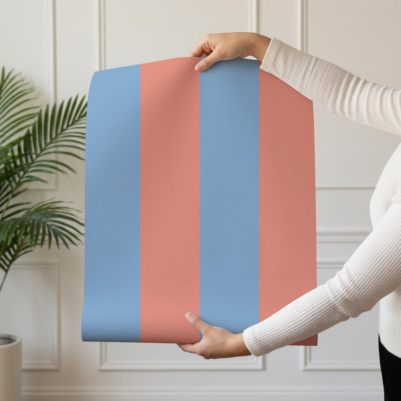 Wide Stripe Wallpaper roll in Cornflower Blue & Soft Coral – graphic, wide stripes on a soft coral ground