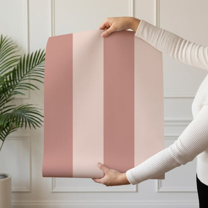 Wide Stripe Wallpaper roll in Dusty Rose & Apricot Blush – graphic, wide stripes on an apricot blush ground