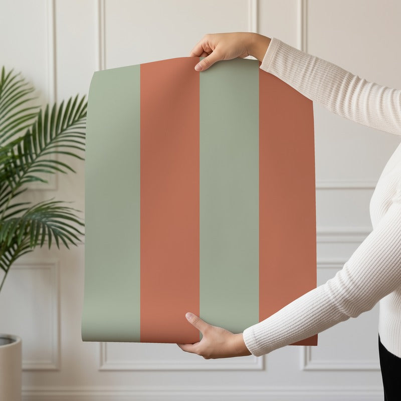 Wide Stripe Wallpaper roll in Sage & Baked Clay – graphic, wide stripes on a baked clay ground