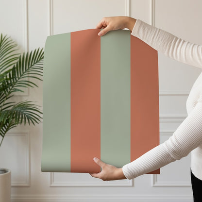 Wide Stripe Wallpaper roll in Sage & Baked Clay – graphic, wide stripes on a baked clay ground