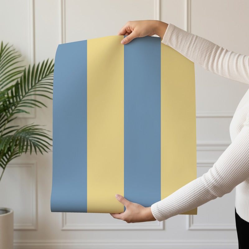 Wide Stripe Wallpaper roll in Soft Denim & Pale Yellow – graphic, wide stripes on a pale yellow ground