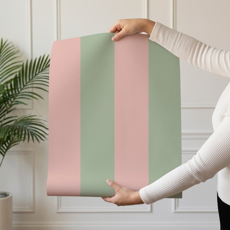 Wide Stripe Wallpaper roll in Warm Blush & Soft Sage – graphic, wide stripes on a soft sage ground